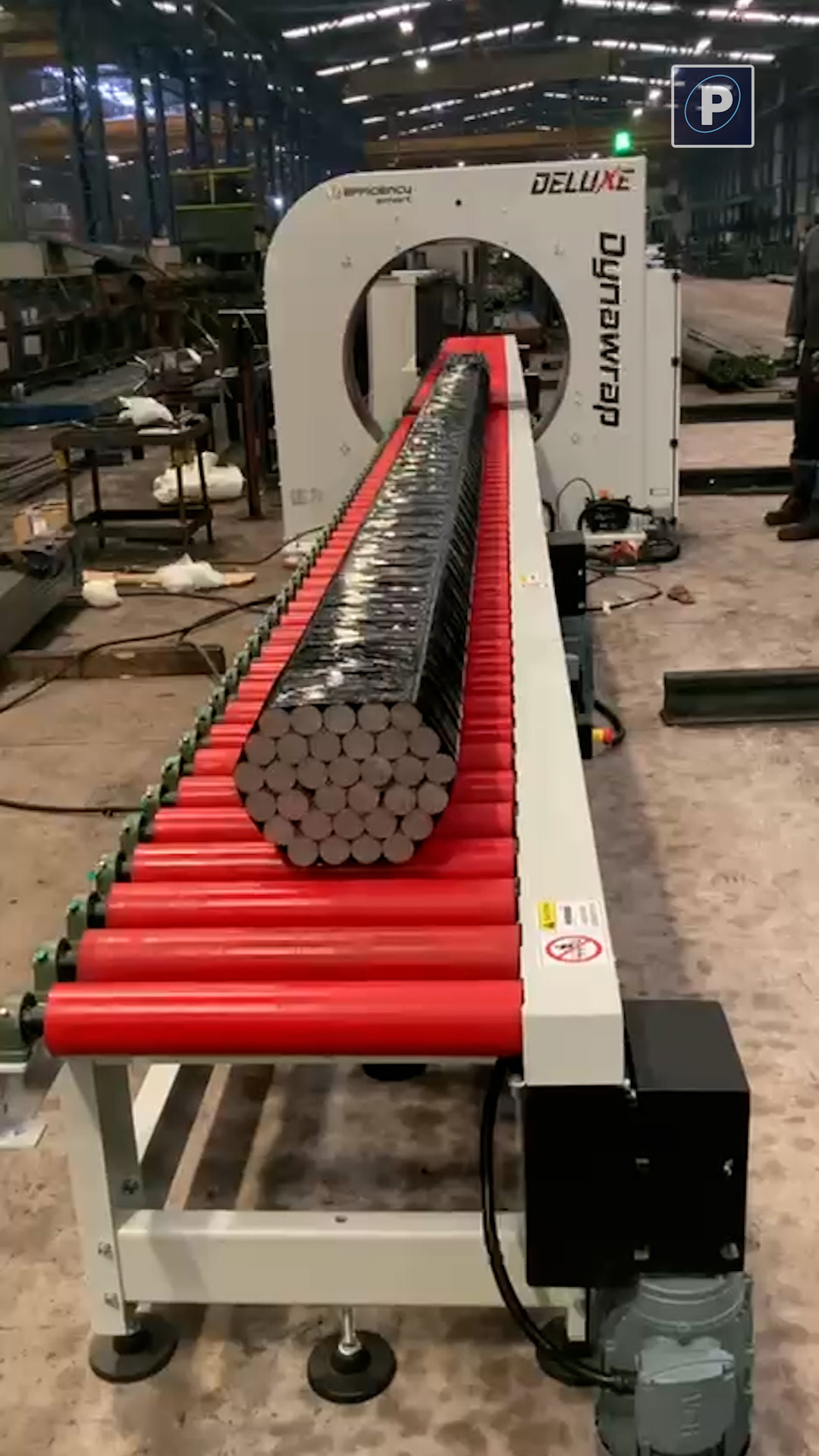 Long product on orbital wrapper conveyor